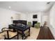 Office with a large desk, decorative rug, and doorway leading to the next room at 35 Tradd St, Charleston, SC 29401