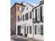 This home features classic architecture with black shutters and a Juliet balcony at 35 Tradd St, Charleston, SC 29401