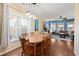 Dining room featuring a wooden table and chairs, with view into the bright living room at 3818 Tupelo Church Ln, Mount Pleasant, SC 29429