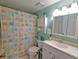 Full bathroom featuring a vanity, a seashell-themed shower curtain, and modern fixtures for comfortable living at 409 Reserve Way, Summerville, SC 29485