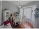 Bright dining area with modern light fixture, stylish glass table, seating for four, and bright natural lighting at 409 Reserve Way, Summerville, SC 29485