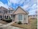 Charming townhouse with dormer windows, a brick facade, and a well-manicured lawn at 409 Reserve Way, Summerville, SC 29485