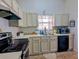 Functional kitchen featuring white cabinetry, modern appliances, and efficient layout, perfect for culinary enthusiasts at 409 Reserve Way, Summerville, SC 29485