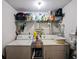 Functional laundry room with shelving, with a stacked washer and dryer at 409 Reserve Way, Summerville, SC 29485
