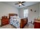 Charming bedroom featuring a wood sleigh bed, nautical theme, and bedside table at 418 Myers Mayo Rd, Ridgeville, SC 29472