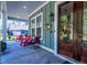 Inviting front porch with cozy seating, great for relaxing and enjoying the outdoors at 418 Myers Mayo Rd, Ridgeville, SC 29472