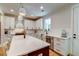 Bright kitchen with white cabinets, stainless steel appliances, and a large island at 418 Myers Mayo Rd, Ridgeville, SC 29472