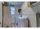 Clean laundry room features a washer, dryer, shelving and tile floor at 418 Myers Mayo Rd, Ridgeville, SC 29472