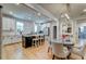 Open-concept living room with dining area and a modern kitchen in background at 418 Myers Mayo Rd, Ridgeville, SC 29472