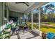 Relaxing screened porch with comfortable seating, perfect for enjoying the outdoors bug-free at 418 Myers Mayo Rd, Ridgeville, SC 29472