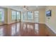 Open living room featuring hardwood floors, large windows, recessed lighting, and a ceiling fan at 4637 Bonnie Marie Way, North Charleston, SC 29405