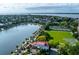 Stunning aerial view of the charming neighborhood, featuring a picturesque lake, lush greenery, and waterfront homes at 47 Ashley Ave, Charleston, SC 29401