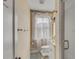 Bright bathroom with a shower, toilet, sink and white cabinets at 47 Ashley Ave, Charleston, SC 29401