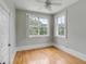 Bedroom featuring hardwood floors, a window, and white base trim at 47 Ashley Ave, Charleston, SC 29401