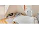 A comforting bedroom features a bed and dresser with hardwood floors at 47 Ashley Ave, Charleston, SC 29401