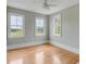 Bedroom featuring hardwood floors, white base trim, and multiple windows at 47 Ashley Ave, Charleston, SC 29401