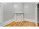 Bedroom featuring hardwood floors and a decorative fireplace with white trim at 47 Ashley Ave, Charleston, SC 29401