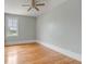 Bedroom featuring hardwood floors, a window with a view and a ceiling fan at 47 Ashley Ave, Charleston, SC 29401