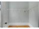 Walk in closet featuring built in shelving, hardwood floors, and fresh paint at 47 Ashley Ave, Charleston, SC 29401