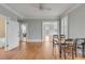 Spacious dining room featuring wood floors, light gray walls, and a ceiling fan at 47 Ashley Ave, Charleston, SC 29401