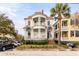Charming two-story home featuring double balconies with columns, a brick staircase and a manicured front yard at 47 Ashley Ave, Charleston, SC 29401