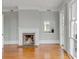 Living room featuring a fireplace, wood floors, and access to a sunroom at 47 Ashley Ave, Charleston, SC 29401