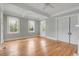 Spacious room featuring beautiful hardwood floors, three large windows, and detailed trim work at 47 Ashley Ave, Charleston, SC 29401
