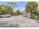 View of the property parking lot surrounded by beautiful trees and landscaping at 47 Ashley Ave, Charleston, SC 29401