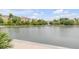 Picturesque view of a pond or lake with trees and buildings in the background at 47 Ashley Ave, Charleston, SC 29401