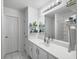 Bathroom featuring a white vanity, framed mirror, and modern lighting at 4875 Carnoustie Ct, Summerville, SC 29485