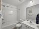 Bathroom featuring shower-tub combo, white vanity, and framed mirror at 4875 Carnoustie Ct, Summerville, SC 29485