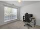 Bedroom setup as an office with natural light from the window at 4875 Carnoustie Ct, Summerville, SC 29485