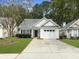 Charming home with attached garage, neat landscaping and driveway at 4875 Carnoustie Ct, Summerville, SC 29485