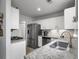 Well-appointed kitchen with stainless steel appliances, granite countertops, and a modern faucet at 4875 Carnoustie Ct, Summerville, SC 29485