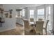 Charming dining area featuring lots of natural light and open to the kitchen at 4875 Carnoustie Ct, Summerville, SC 29485