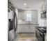 Bright kitchen featuring white cabinetry, stainless steel appliances, and granite countertops at 4875 Carnoustie Ct, Summerville, SC 29485