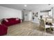 Bright living room featuring wood floors and an open layout at 4875 Carnoustie Ct, Summerville, SC 29485