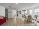 Open-concept living room featuring wood floors and an open layout at 4875 Carnoustie Ct, Summerville, SC 29485