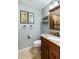 Well-lit bathroom with a granite countertop vanity and framed mirror with neutral wall color at 524 Cobby Creek Ln, Seabrook Island, SC 29455