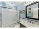 Bright bathroom featuring a tub with sliding glass doors, a vanity with marble countertop, and coastal-themed decor at 524 Cobby Creek Ln, Seabrook Island, SC 29455