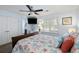 Comfortable bedroom featuring a queen-size bed with coastal bedding and a mounted television at 524 Cobby Creek Ln, Seabrook Island, SC 29455