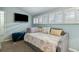 Relaxing bedroom featuring a daybed, plantation shutters on the windows and a TV at 524 Cobby Creek Ln, Seabrook Island, SC 29455