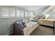 Cozy bedroom with plantation shutters on the windows and a comfortable daybed, offering a relaxing retreat at 524 Cobby Creek Ln, Seabrook Island, SC 29455