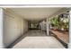 Spacious carport with ample parking, with stairs leading to the upper levels and a glimpse of the surrounding landscape at 524 Cobby Creek Ln, Seabrook Island, SC 29455