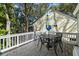 Outdoor dining area with a table and chairs on the deck, offering a comfortable space for enjoying meals outdoors at 524 Cobby Creek Ln, Seabrook Island, SC 29455