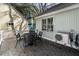 Comfortable outdoor dining area with a table and chairs, with an HVAC unit on the deck at 524 Cobby Creek Ln, Seabrook Island, SC 29455