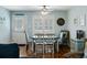 Charming dining room with hardwood floors, white table and chairs, complemented by bright wall paint at 524 Cobby Creek Ln, Seabrook Island, SC 29455