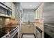 Well-equipped kitchen featuring stainless steel appliances, granite countertops, and ample cabinet space at 524 Cobby Creek Ln, Seabrook Island, SC 29455