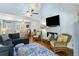Stylish living room with an open layout, hardwood floors, vaulted ceiling, and cozy decor at 524 Cobby Creek Ln, Seabrook Island, SC 29455
