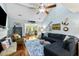 Bright and airy living room with vaulted ceilings, ceiling fan, hardwood floors, and a cozy seating area at 524 Cobby Creek Ln, Seabrook Island, SC 29455